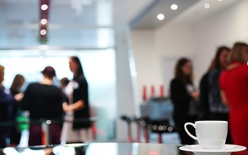 blurred image of women at networking event